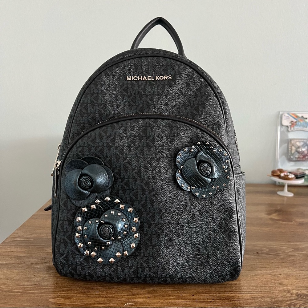Michael Kors metallic Blue Backpack with Floral Embellishments